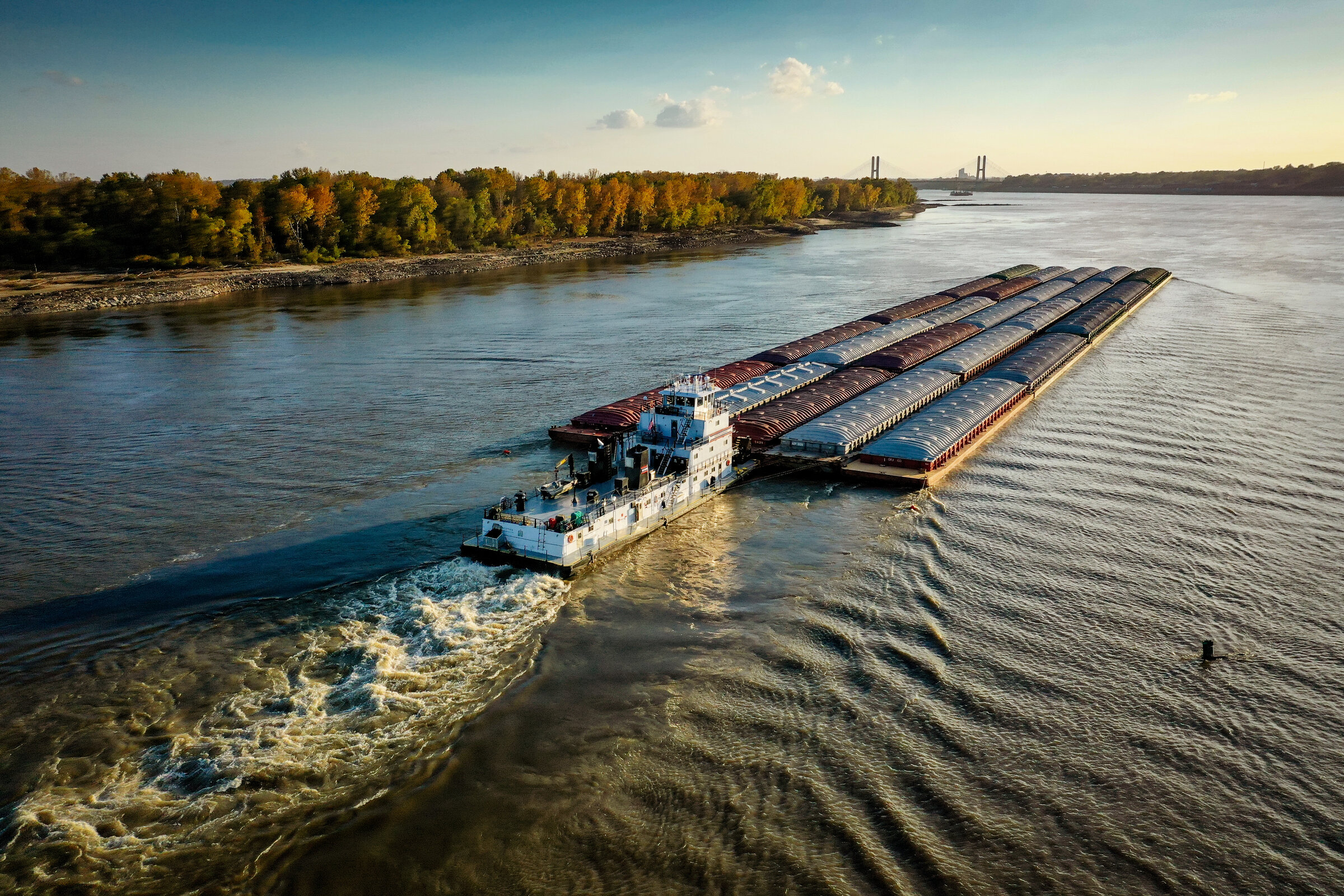 Towboat pushing a barge fleet on a river